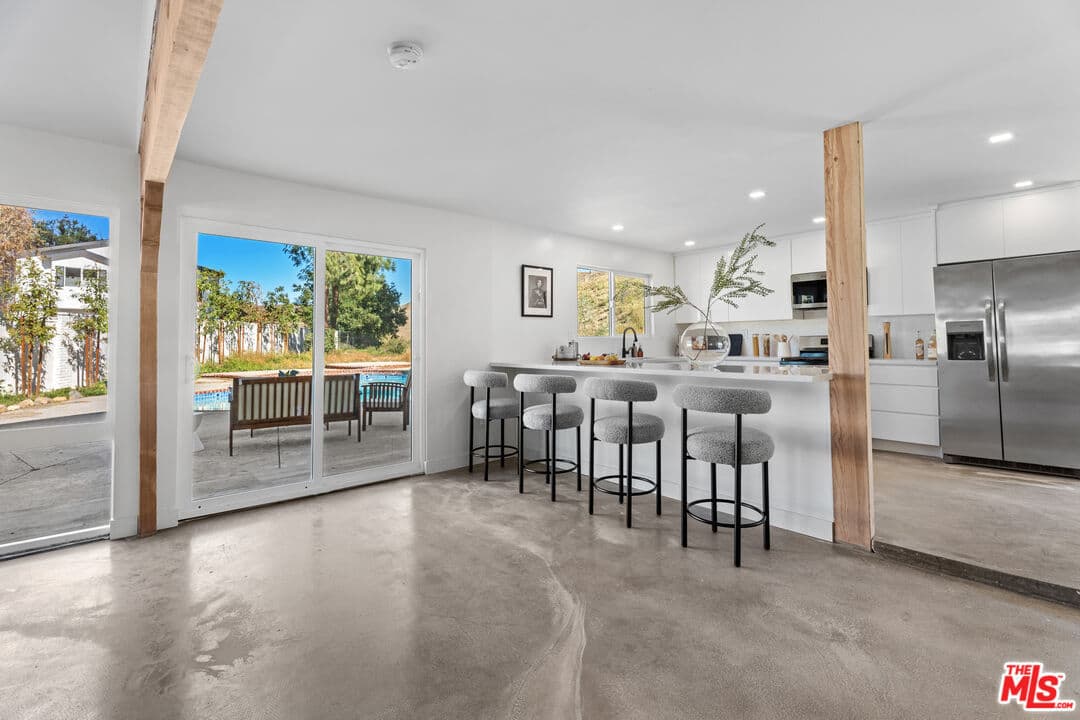 Remodeled open kitchen overlooking the pool at 26004 Redbluff Drive